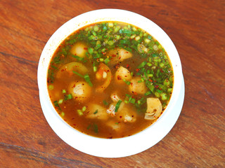 Hot and spicy soup with pork ribs, shallow Depth of Field, Focus on pork ribs