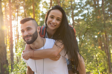 Fototapeta premium Young hikers backpacking in the woods