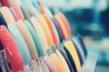 colorful artificial nails in beauty shop