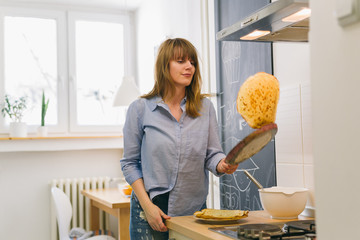 woman preparing pancakes.