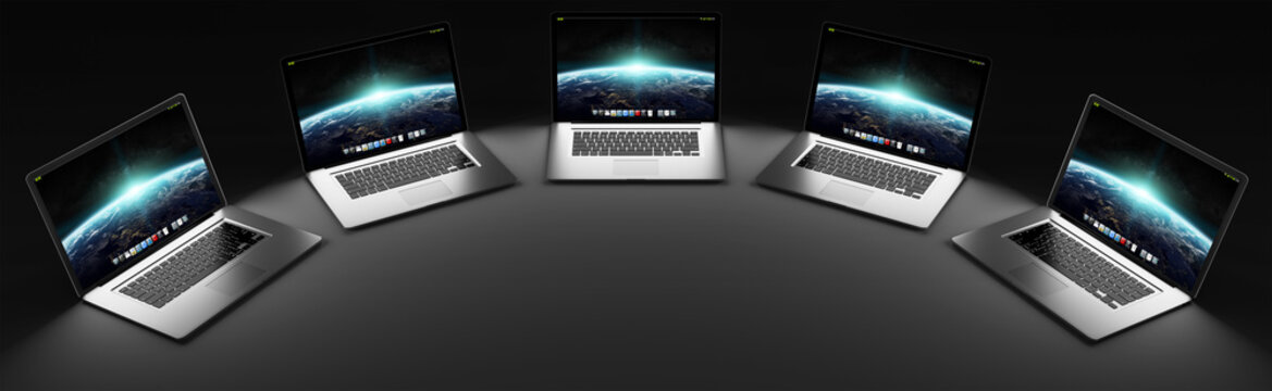 Five modern laptop in the dark 3D rendering
