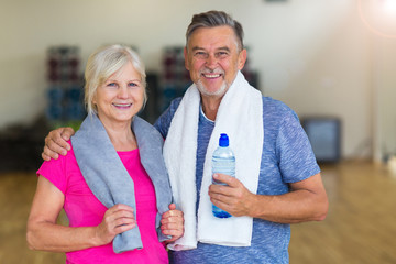 Mature couple doing fitness exercises
