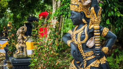 Bali temple entrance with guardian statue