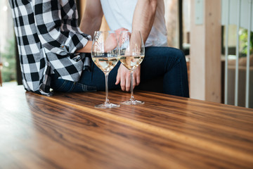 Horizontal shot of champagne with couple on background