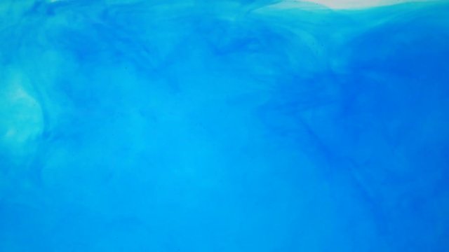 ink poured into water slow motion