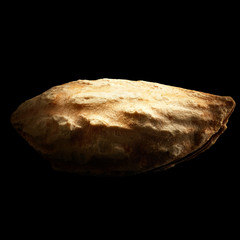 Almond isolated on black background with reflection. Close-up or macro. Health concept