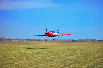Fototapeta na wymiar Flight of a sport aircraft against a blue sky.