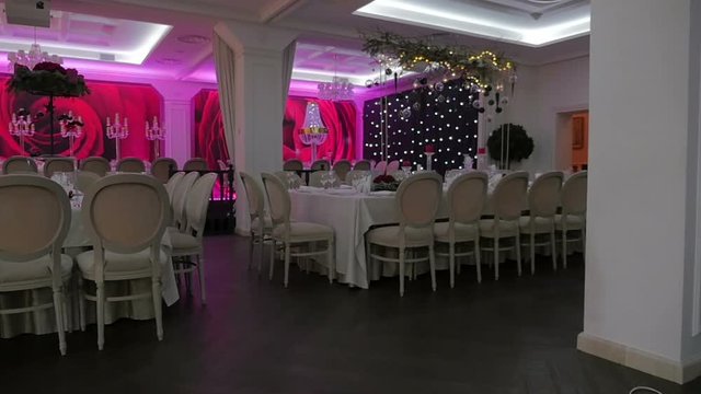 Banquet hall waiting for guests, Large empthy banquet hall. Ready for the holiday banquet hall. Steadicam shot.