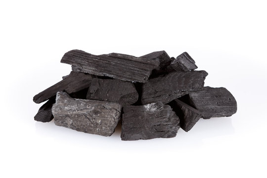 Pile of charcoal isolated on white