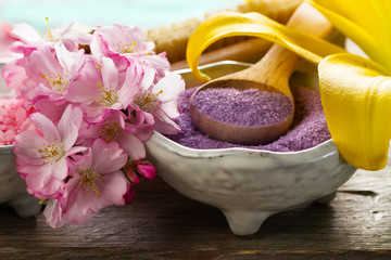 Spa Concept. Closeup of beautiful Spa Products - Spa Salt and Flowers. Horizontal.