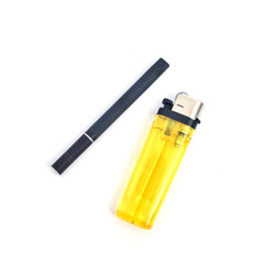 Cigarette and lighter on white background