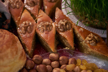 Novruz tray with Azerbaijan national desserts against silk scarf background