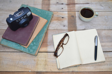 cup of the coffee and vintage book.