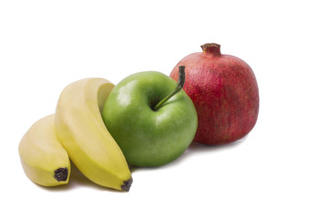 Bananas with green apple and red pomegranate