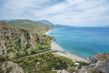 Fototapeta na wymiar Panorama of Preveli beach at Libyan sea, river and palm forest, southern Crete , Greece