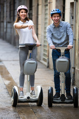 couple traveling by segways