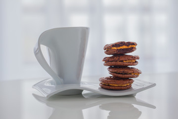Closeup of chocolate cookies and a cup of coffee