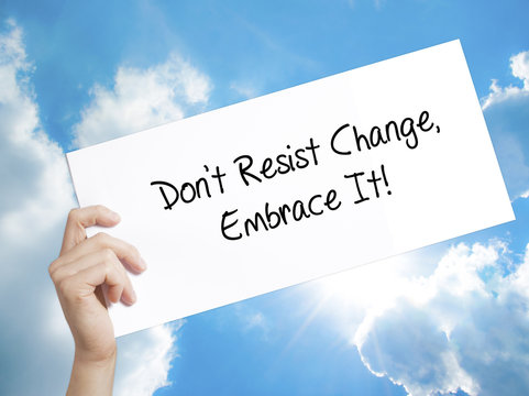 Don't Resist Change, Embrace It! Sign on white paper. Man Hand Holding Paper with text. Isolated on sky background