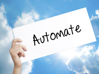 Automate Sign on white paper. Man Hand Holding Paper with text. Isolated on sky background