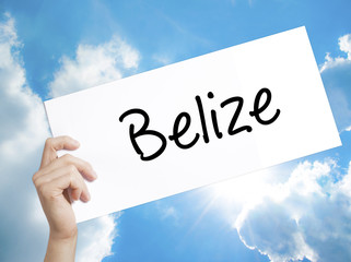 Belize Sign on white paper. Man Hand Holding Paper with text. Isolated on sky background