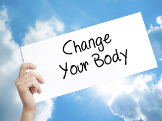Change Your Body Sign on white paper. Man Hand Holding Paper with text. Isolated on sky background.