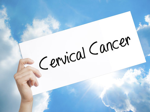 Cervical Cancer Sign on white paper. Man Hand Holding Paper with text. Isolated on sky background