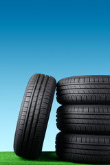 Obraz premium Summer car tyres on grass