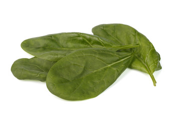 Spinach leaves on white isolated background closeup