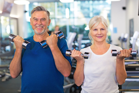 Mature couple doing fitness exercises