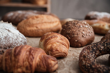 Pastries and bread with flour on table
