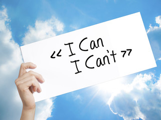 I Can - I Can't Sign on white paper. Man Hand Holding Paper with text. Isolated on sky background