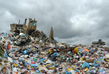 Garbage truck unloading at the dump