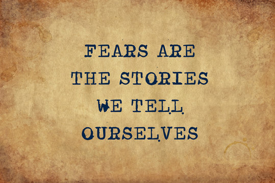 Inspiring motivation quote of fears are the stories we tell ourselves with typewriter text. Distressed Old Paper with Typing image.