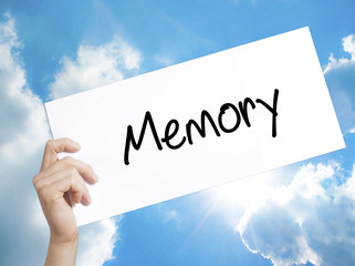Memory  Sign on white paper. Man Hand Holding Paper with text. Isolated on sky background