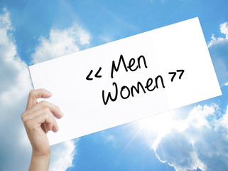 Men - Women Sign on white paper. Man Hand Holding Paper with text. Isolated on sky background