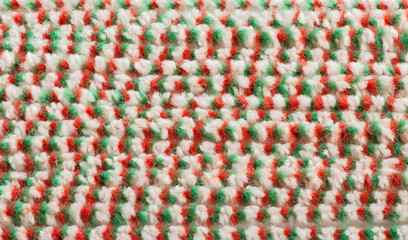 Fototapeta na wymiar Textured material with pile of green-red-white color