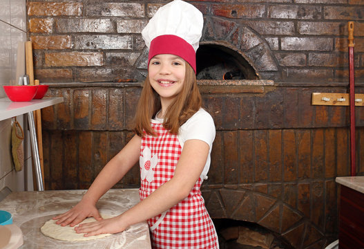 little girl cook real pizza in pizzeria