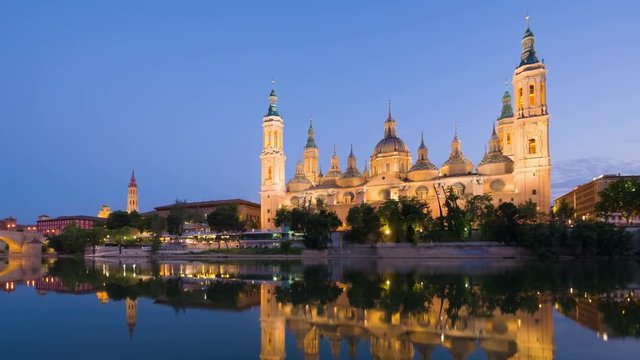 Zoom in timelapse of Zaragoza in a summer sunset