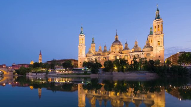 Zoom out timelapse of Zaragoza in a summer sunset