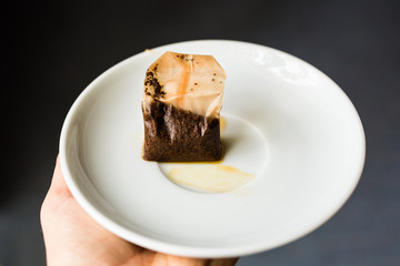 Used Tea Bag on White plate