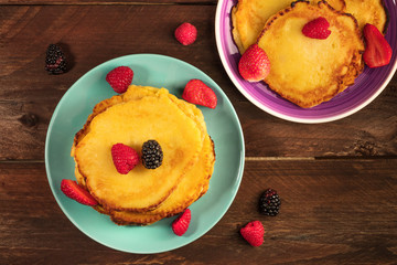 Freshly baked homemade pancakes with fresh fruit