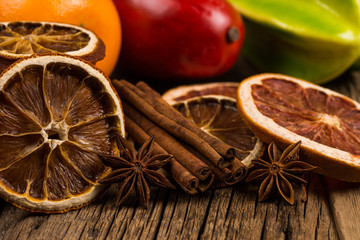 Dried oranges and grapefruits on an old wooden table.