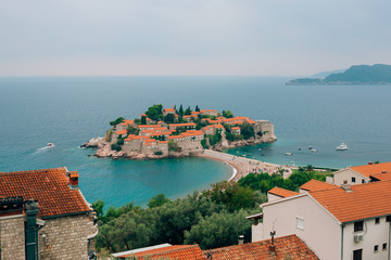 Naklejka na ściany i meble Island of Sveti Stefan, close-up of the island in the afternoon. Montenegro, the Adriatic Sea, the Balkans.