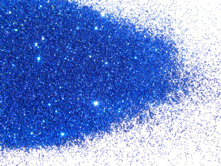 Blue glitter sparkles on white background. 