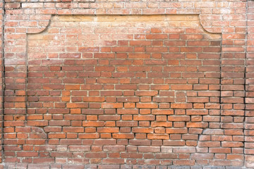 Brick wall with frame shaped decoration