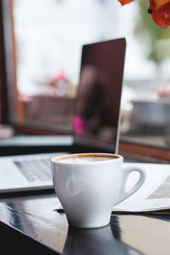 Coffee cup , laptop in coffee shop , business,