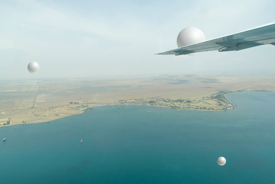 Unidentified flying objects near the aircraft.