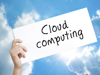 Cloud computing Sign on white paper. Man Hand Holding Paper with text. Isolated on sky background