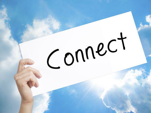 Connect Sign on white paper. Man Hand Holding Paper with text. Isolated on sky background