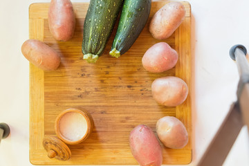 Top view of fresh potatoes and cucumbers